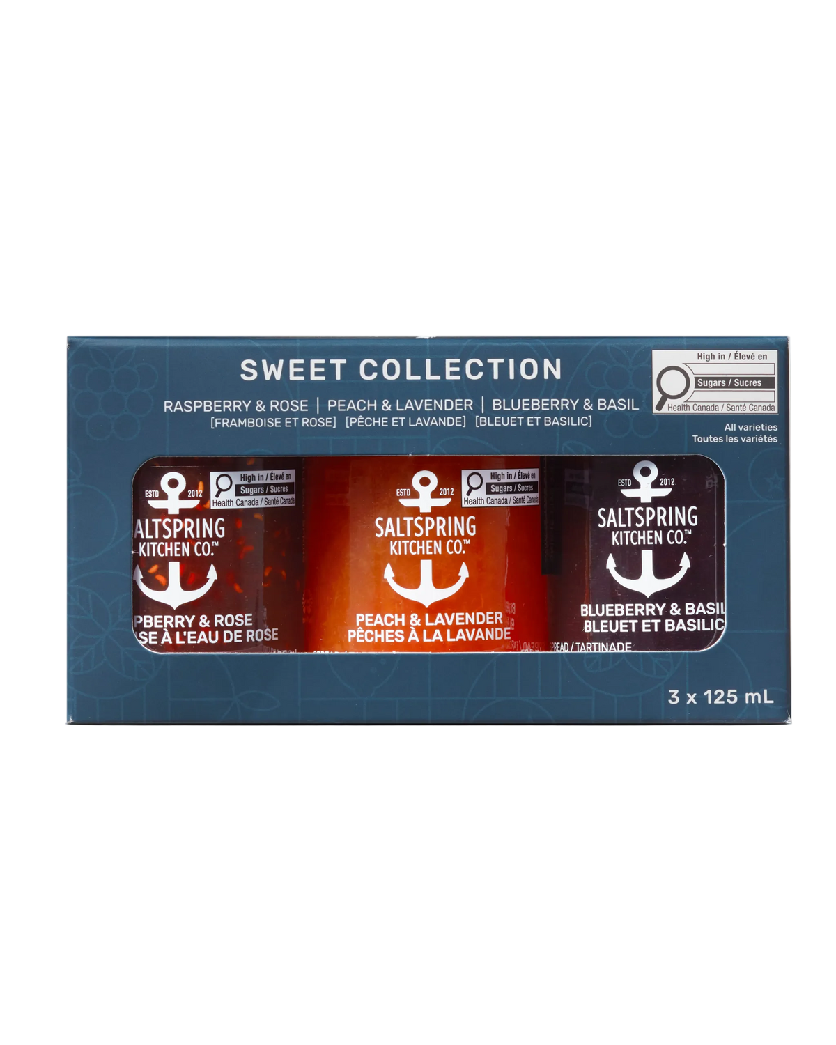 A boxed set of three Saltspring Kitchen Co. preserves in the Sweet Collection, shown in retail packaging against a plain white background.