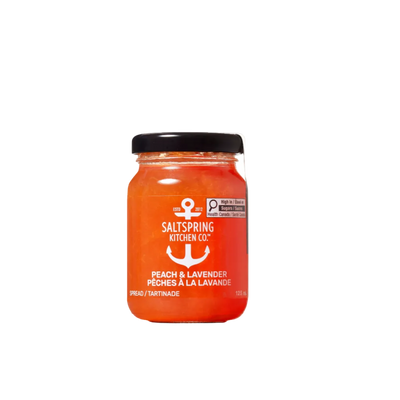 A glass jar of Saltspring Kitchen Co. Peach & Lavender Spread on a solid white background.