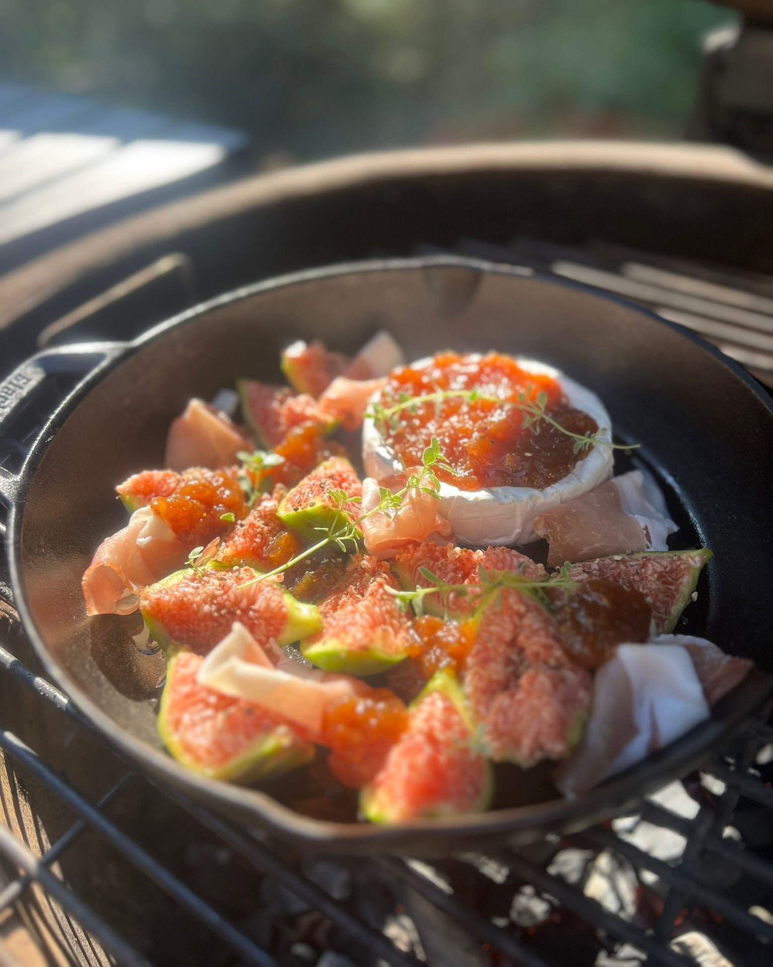 Figs with toppings in a pan on a grill