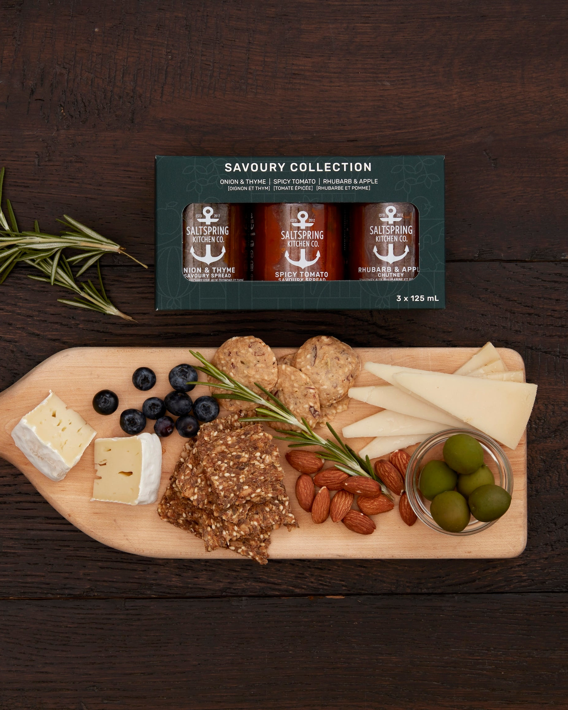 SaltSpring Kitchen Company Savoury Collection on a table with a cheese board